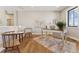 Bright home office featuring hardwood floors, a vintage-style desk, natural light, and designer rug at 1361 Art Dr, Berthoud, CO 80513