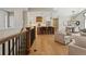 Elegant open concept showcasing the kitchen, living, and dining areas with hardwood floors at 1361 Art Dr, Berthoud, CO 80513