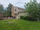 Backyard with a patio, lawn, trees, and home exterior at 5171 S Quintero St, Centennial, CO 80015