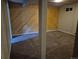 Spacious basement with wood-paneled accent wall, carpet flooring, and natural light at 5171 S Quintero St, Centennial, CO 80015