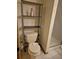 Toilet and shelving unit next to a shower unit at 5171 S Quintero St, Centennial, CO 80015