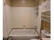 Bathroom with a bathtub and shower combo featuring tile surround and neutral walls at 5171 S Quintero St, Centennial, CO 80015