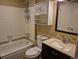 A bathroom featuring a bathtub, vanity, mirror, and overhead cabinet at 5171 S Quintero St, Centennial, CO 80015