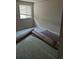 Bedroom with window and rolls of carpet, ready for new flooring and personalization at 5171 S Quintero St, Centennial, CO 80015