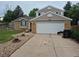 Charming two-story home with a two car garage, brick accents and a well maintained yard at 5171 S Quintero St, Centennial, CO 80015