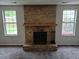 Brick fireplace with mantel and windows at 5171 S Quintero St, Centennial, CO 80015