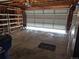 Spacious two-car garage with shelving and white door at 5171 S Quintero St, Centennial, CO 80015