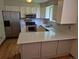 The kitchen features stainless steel appliances and white countertops at 5171 S Quintero St, Centennial, CO 80015