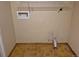 Laundry room with yellow tiled floor and open wall features at 5171 S Quintero St, Centennial, CO 80015