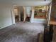 A living room with a fireplace, stairs, and an open view of the kitchen area at 5171 S Quintero St, Centennial, CO 80015