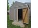 Exterior view of a backyard shed with open doors, offering extra storage space at 5171 S Quintero St, Centennial, CO 80015