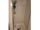 Shower with mounted shelving unit at 5171 S Quintero St, Centennial, CO 80015