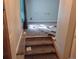 Stairway leading to living room with carpeted floors and blue curtains at 5171 S Quintero St, Centennial, CO 80015