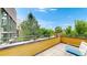 Outdoor balcony offering a relaxing space with seating and scenic neighborhood views at 8041 E 29Th Ave, Denver, CO 80238