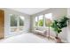 Bright bedroom with large windows providing abundant natural light and views of mature trees at 8041 E 29Th Ave, Denver, CO 80238