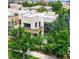 Modern exterior with a flat roof, many windows and lush landscaping at 8041 E 29Th Ave, Denver, CO 80238