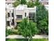 Modern exterior with a flat roof, many windows and lush landscaping at 8041 E 29Th Ave, Denver, CO 80238