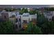 Exterior of a modern home with a patio surrounded by lush landscaping at 8041 E 29Th Ave, Denver, CO 80238
