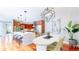 This open kitchen and dining area offers a center island, stainless appliances, and an eat-in dining area at 8041 E 29Th Ave, Denver, CO 80238