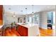 Modern kitchen with stainless steel appliances, a large island, and ample counter space at 8041 E 29Th Ave, Denver, CO 80238