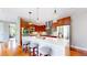Bright, modern kitchen with stainless steel appliances, quartz countertops, and hardwood floors at 8041 E 29Th Ave, Denver, CO 80238