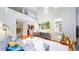 Bright living room features soaring ceilings, hardwood floors, media center and modern furnishings at 8041 E 29Th Ave, Denver, CO 80238