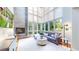 Bright living room with floor-to-ceiling windows and a cozy fireplace at 8041 E 29Th Ave, Denver, CO 80238