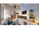 Living room with soaring ceilings, hardwood floors, modern media center and comfortable furnishings at 8041 E 29Th Ave, Denver, CO 80238