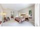 This large primary suite features a sitting area, walk-in closet, and ensuite bathroom at 8041 E 29Th Ave, Denver, CO 80238