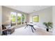 Bright and airy home office with modern furniture, large windows and a comfortable chair at 8041 E 29Th Ave, Denver, CO 80238