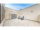 Comfortable outdoor patio with a fireplace and seating area at 8041 E 29Th Ave, Denver, CO 80238