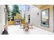 This outdoor patio features an open-air fireplace and ample space for entertaining and outdoor dining at 8041 E 29Th Ave, Denver, CO 80238