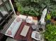 Cozy patio space features comfortable seating, a neutral rug, and an umbrella at 8041 E 29Th Ave, Denver, CO 80238