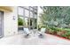 Outdoor patio area with comfortable seating and a view of the lush greenery at 8041 E 29Th Ave, Denver, CO 80238