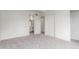 Carpeted bedroom featuring a double door closet and attached bathroom at 9725 E Harvard Ave # 317, Denver, CO 80231