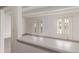Bright living room featuring sliding doors, carpeted floors and white walls at 9725 E Harvard Ave # 317, Denver, CO 80231