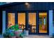 View of back porch with chairs, lighting, and potted plants at 7121 E Arkansas Ave, Denver, CO 80224