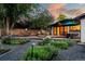 Outdoor space with deck, flower beds, gravel, dining table and fence at 7121 E Arkansas Ave, Denver, CO 80224