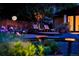 Cozy backyard with lighting, patio, lounge chairs and landscaping at 7121 E Arkansas Ave, Denver, CO 80224