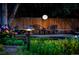 Cozy backyard and patio with seating and string lights at 7121 E Arkansas Ave, Denver, CO 80224