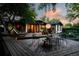 Relaxing backyard with a deck, chairs and mature landscaping at 7121 E Arkansas Ave, Denver, CO 80224