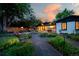 Landscaped backyard with deck and dining table with seating at 7121 E Arkansas Ave, Denver, CO 80224