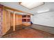 Finished basement features tile flooring, a wood support beam and built-in bunk beds with colorful accents at 7121 E Arkansas Ave, Denver, CO 80224