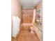 Full bathroom with tile walls, integrated tub, and vanity with stone countertop at 7121 E Arkansas Ave, Denver, CO 80224