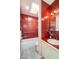 Bathroom featuring red tiles, a shower-tub combination, and modern fixtures at 7121 E Arkansas Ave, Denver, CO 80224