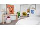 Tastefully decorated bedroom area with a desk, chair, and various decorative items at 7121 E Arkansas Ave, Denver, CO 80224