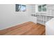 A well-organized walk-in closet with custom shelves and wooden floors, providing ample storage at 7121 E Arkansas Ave, Denver, CO 80224