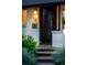Exterior view of home's front door and brick facade at 7121 E Arkansas Ave, Denver, CO 80224