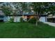 Well-maintained front yard and exterior view of the home at 7121 E Arkansas Ave, Denver, CO 80224
