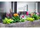 A window box bursting with colorful flowers adds charm to this building's exterior at 7121 E Arkansas Ave, Denver, CO 80224